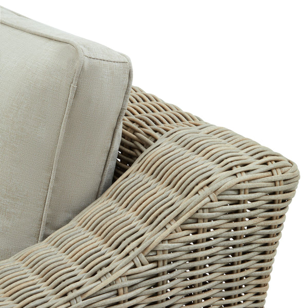 Chunky Rattan-Style Armchair with Plush Cushions & Subtle Metal Detailing