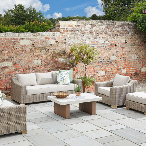 Chunky Rattan-Style Armchair with Plush Cushions & Subtle Metal Detailing