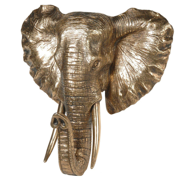 A golden elephant head wall mount on a white background