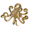An octopus-shaped candle holder with elegant gold accents