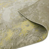 Close-up of a rectangular golden lustre rug with a folded corner