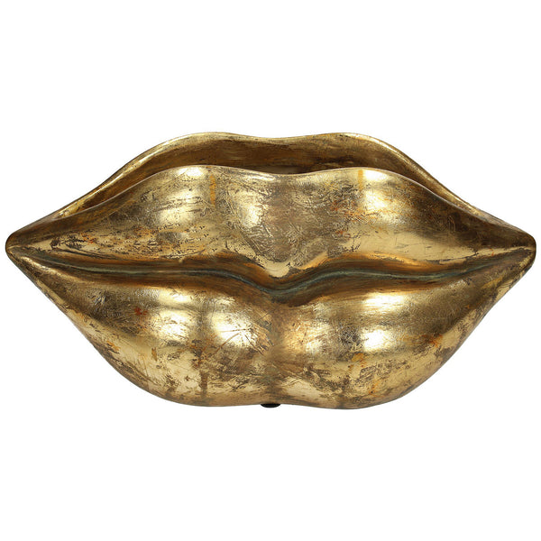 A golden lips planter on a white background