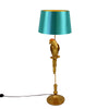 A golden parrot floor lamp with a turquoise shade on a white background