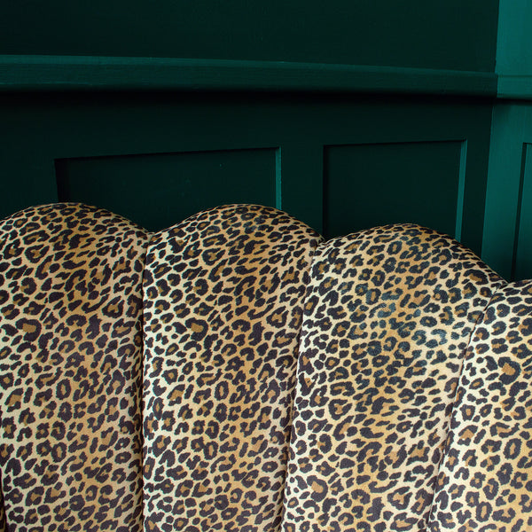 Close-up of a leopard print chair with petal chair design