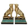 Two golden leopard bookends on a white background